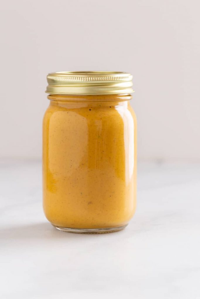 Butter chicken sauce in a glass jar
