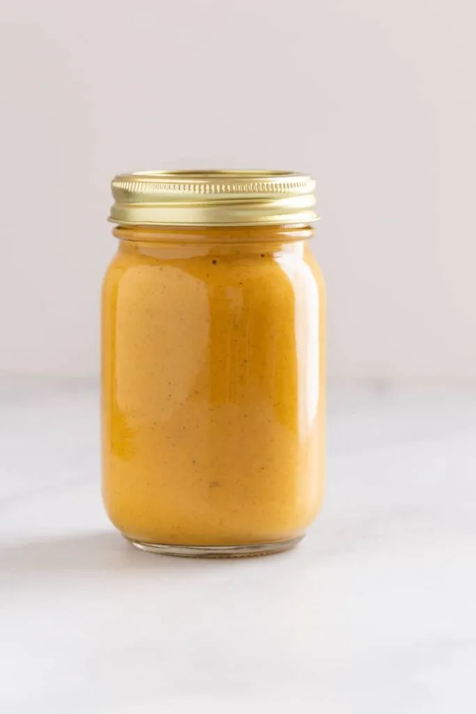 Butter chicken sauce in a glass jar