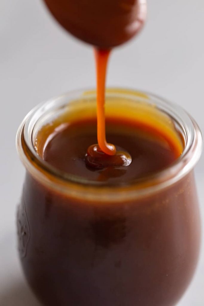 Easy Homemade Caramel Sauce drizzled in jar