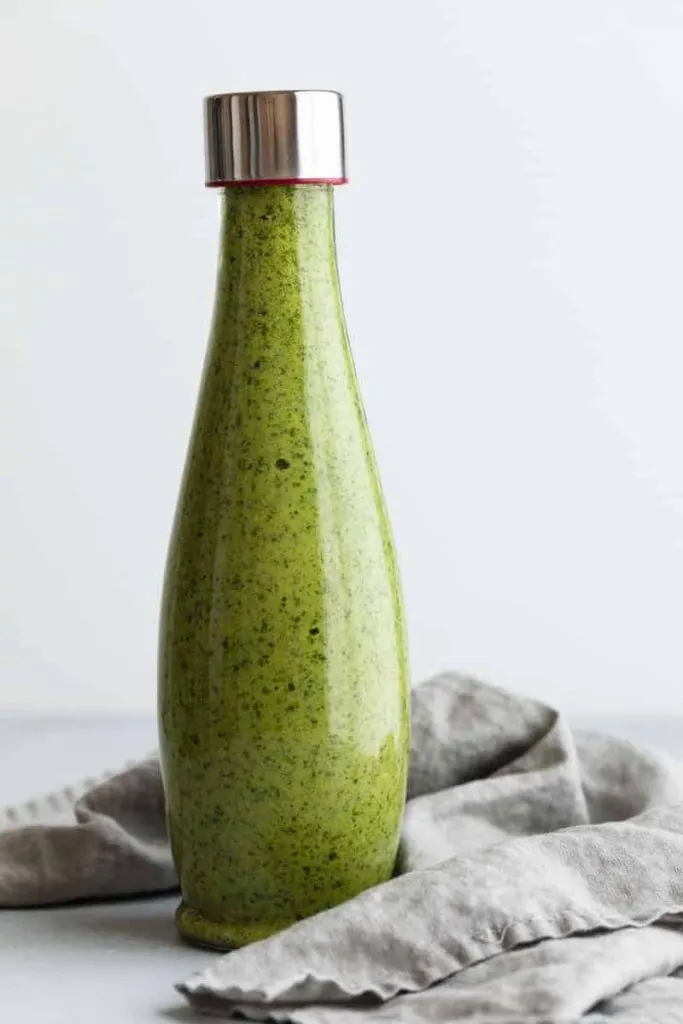 Peruvian Green Sauce in a glass jar