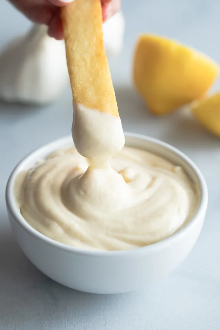 french fry dipped in roasted garlic aioli sauce