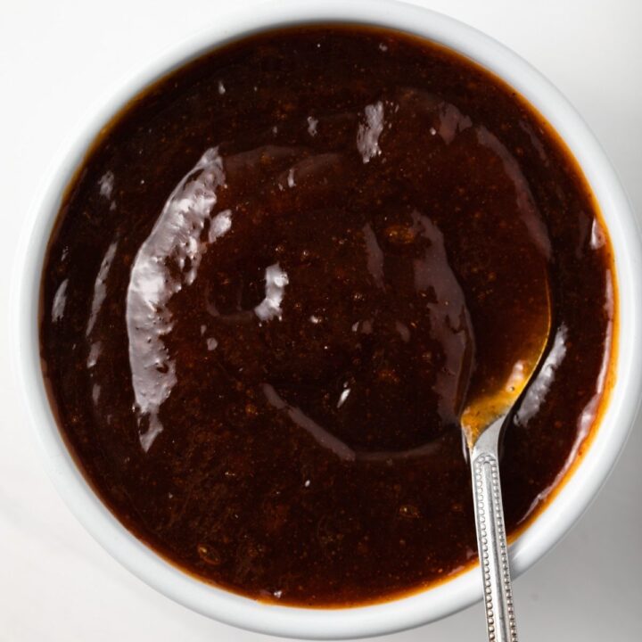 Overhead of apricot bbq sauce in white bowl.
