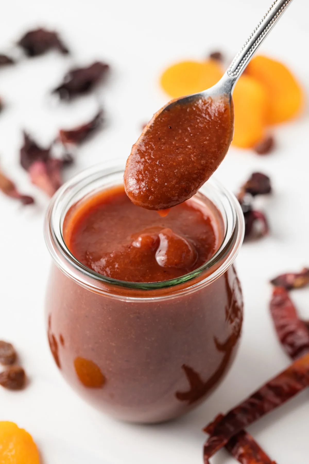 Chamoy sauce spooned out of a jar.