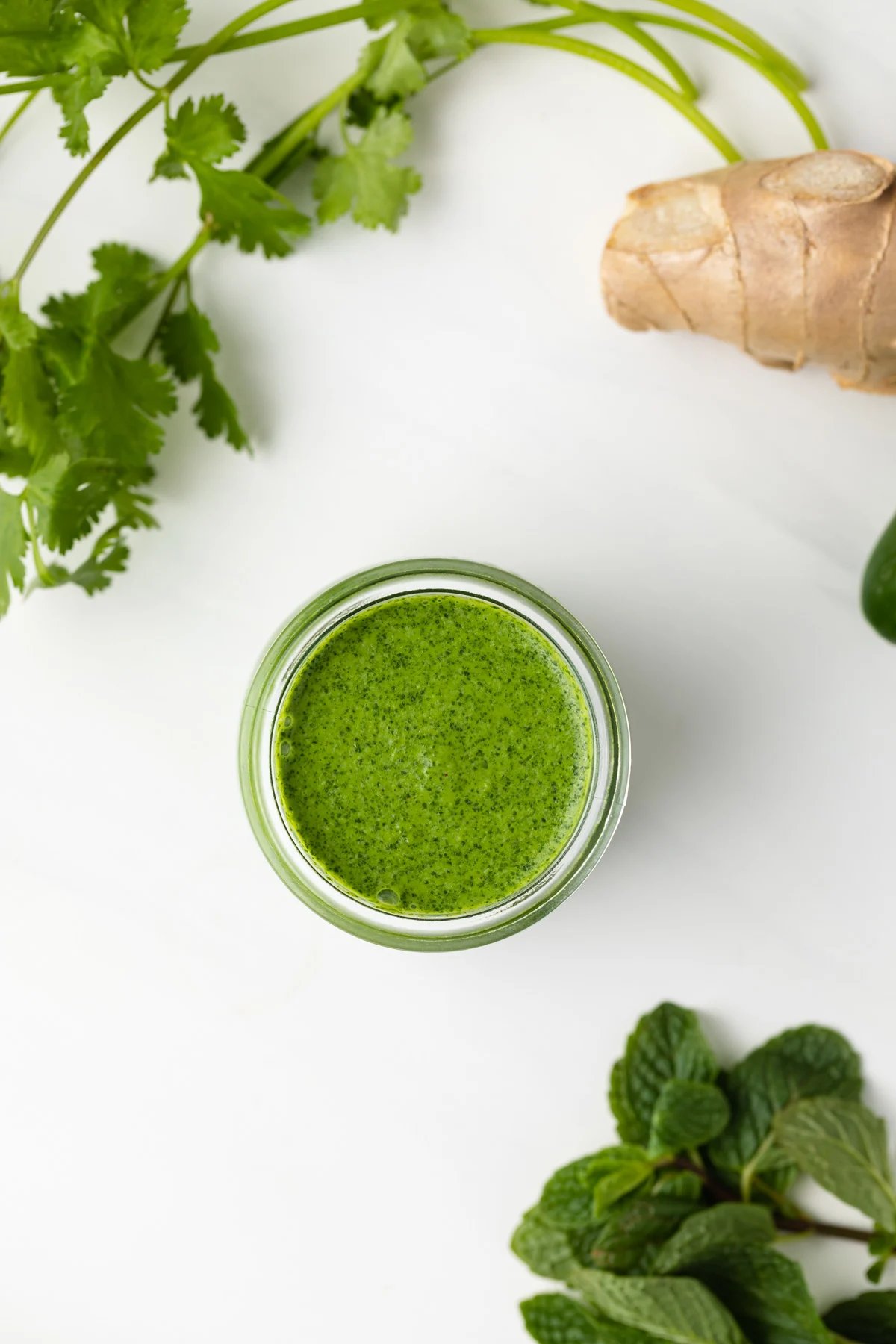 Overhead view of yogurt mint sauce in a jar.