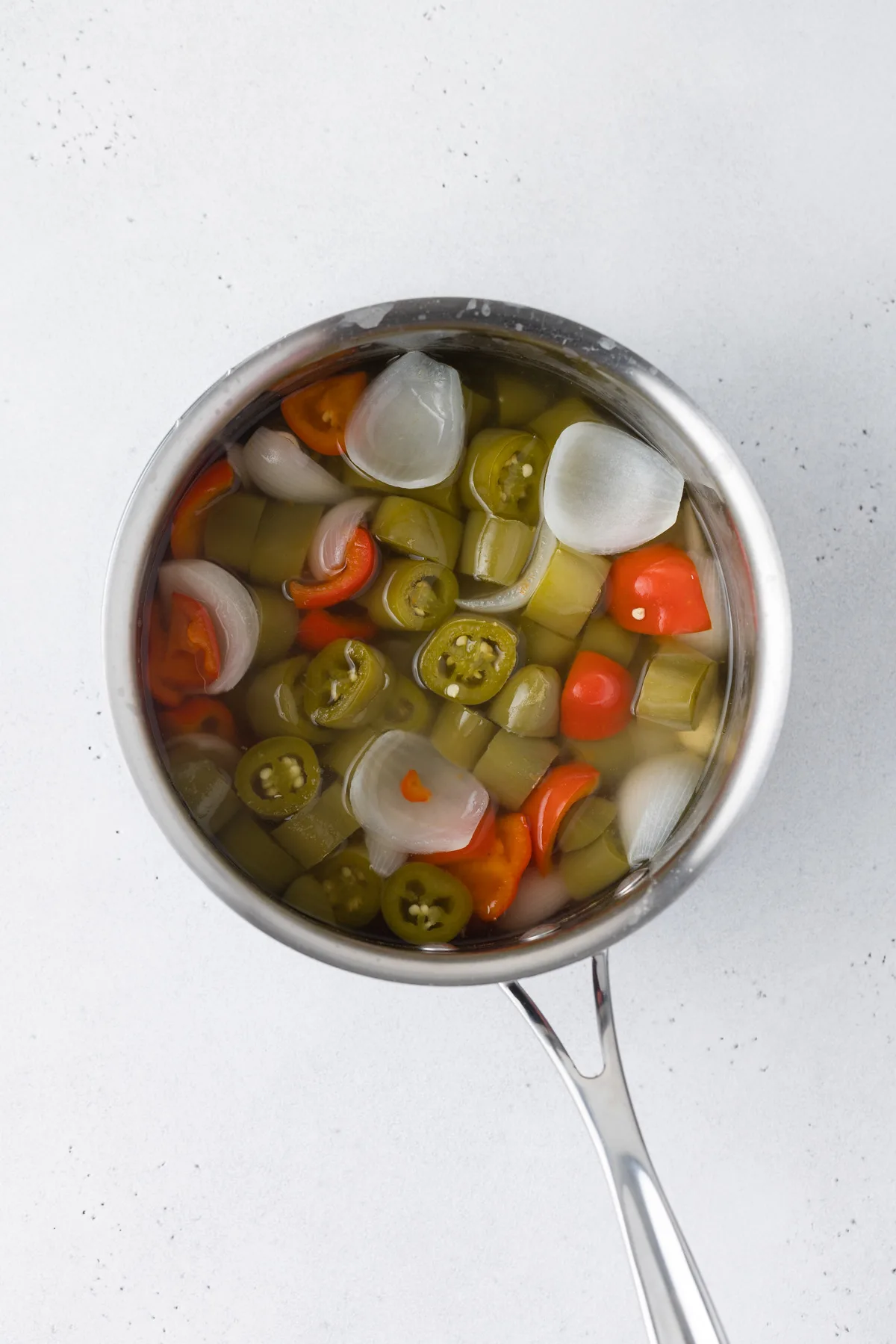 Cooked ingredients in a sauce pan.