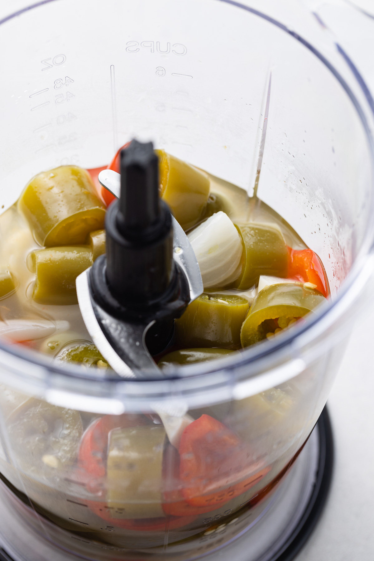 Cooked ingredients in a food processor.