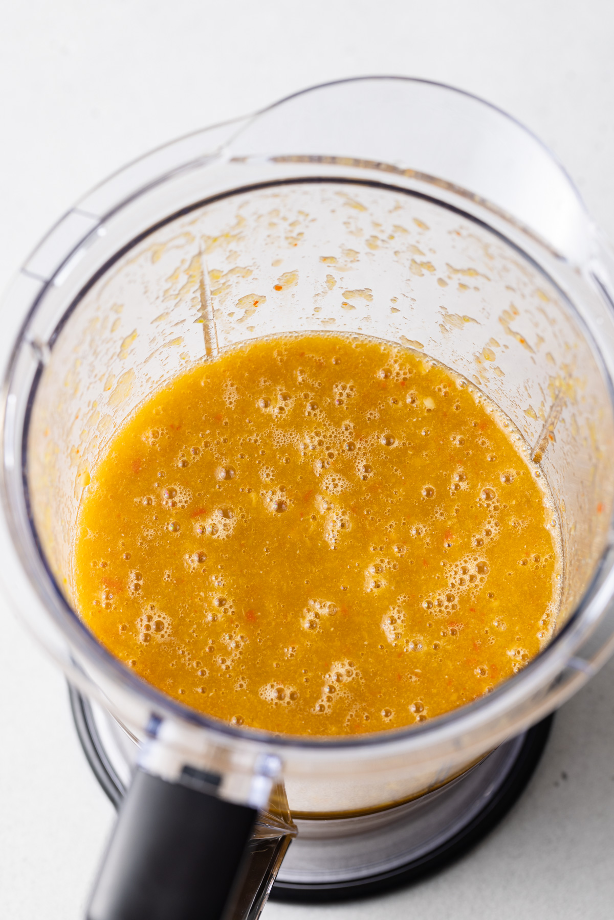 Pureed hot sauce in a food processor.