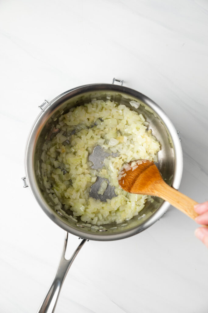 Sauteed onions in a pot.