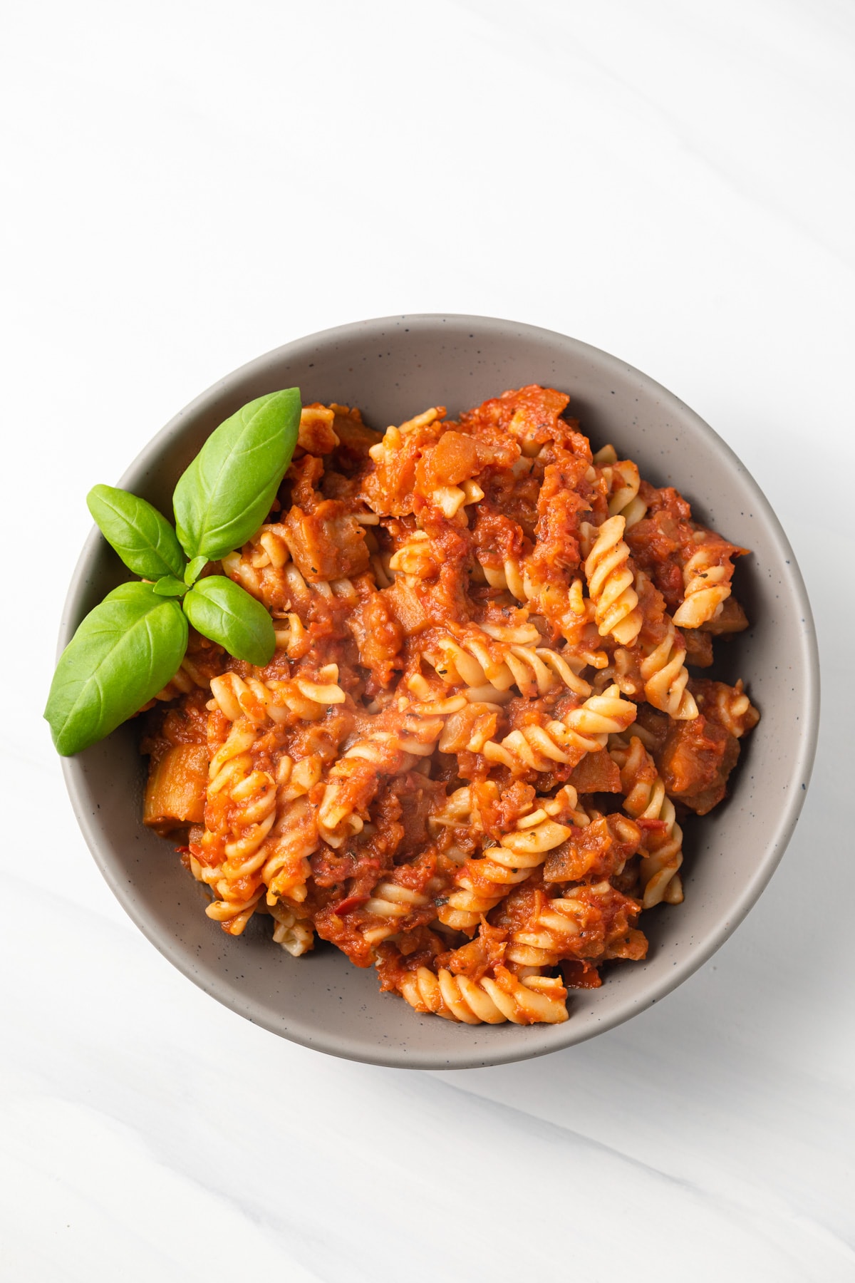 Overhead of eggplant tomato sauce with pasta.