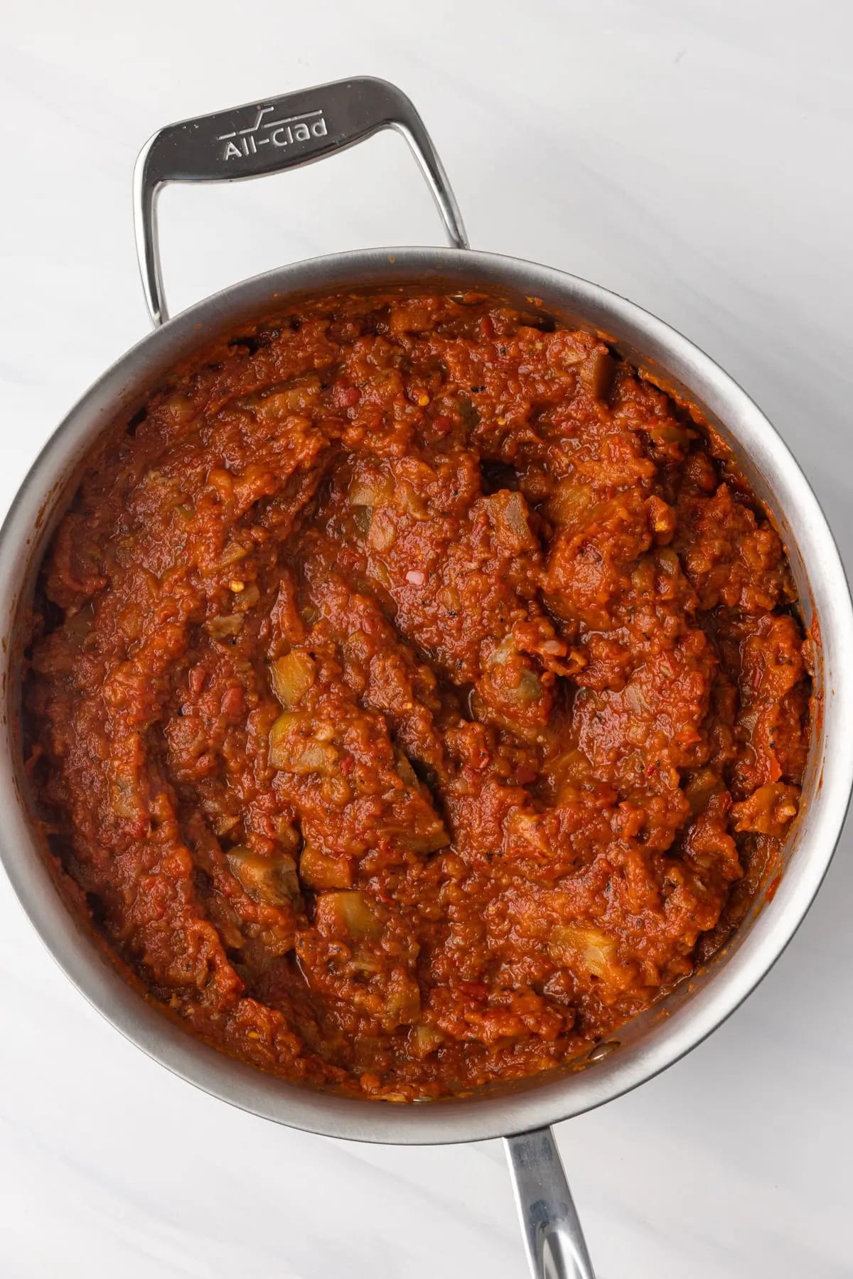 Eggplant tomato sauce in fry pan.