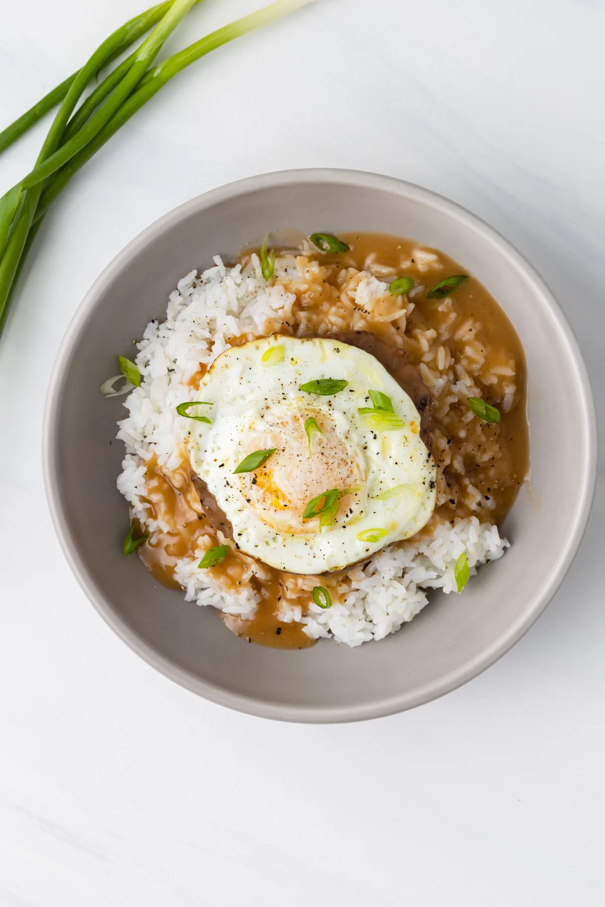 Over head of loco moco in a bowl.