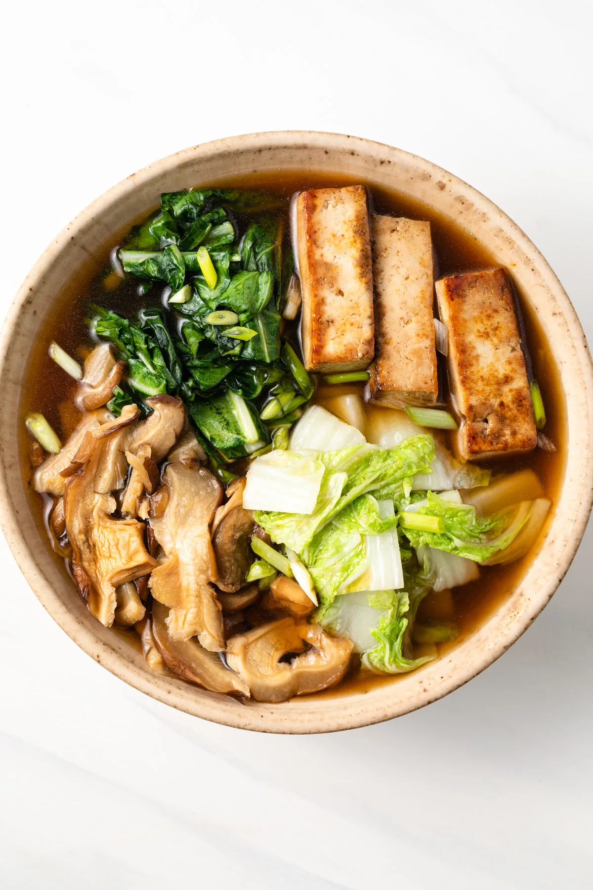 Overhead of a bowl of Japanese sukiyaki.