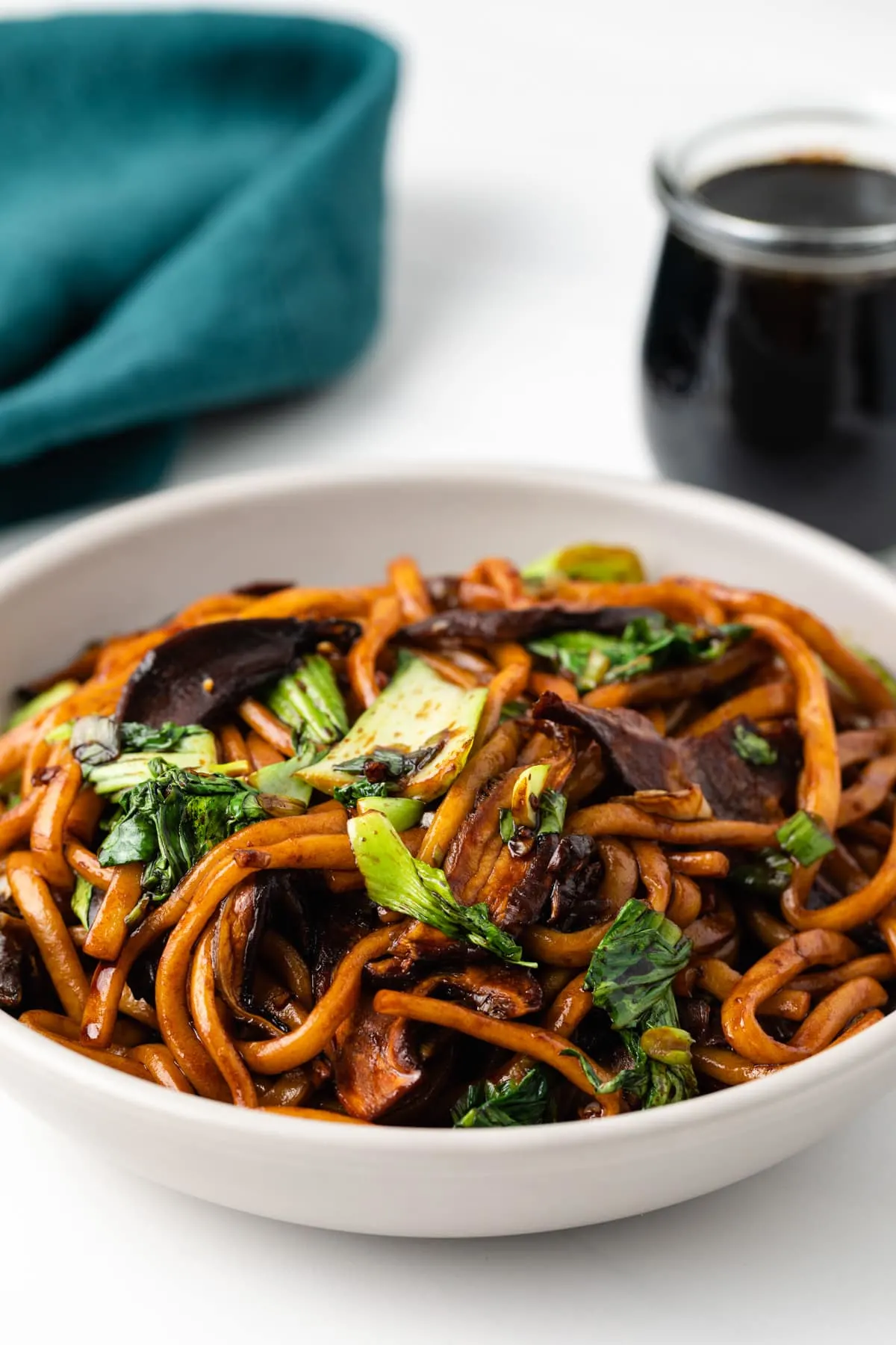 Stir fried udon noodles in a bowl.