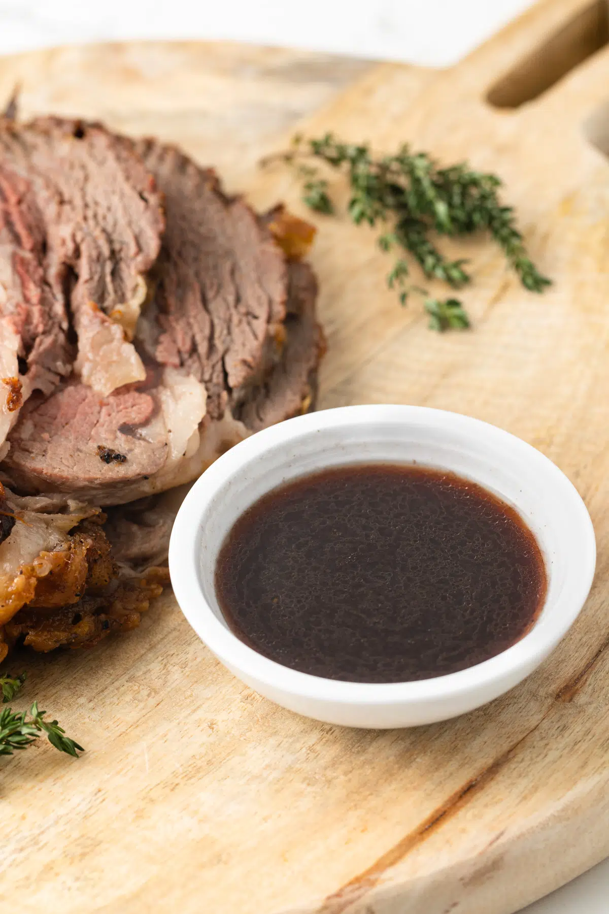 Au jus sauce in a bowl.