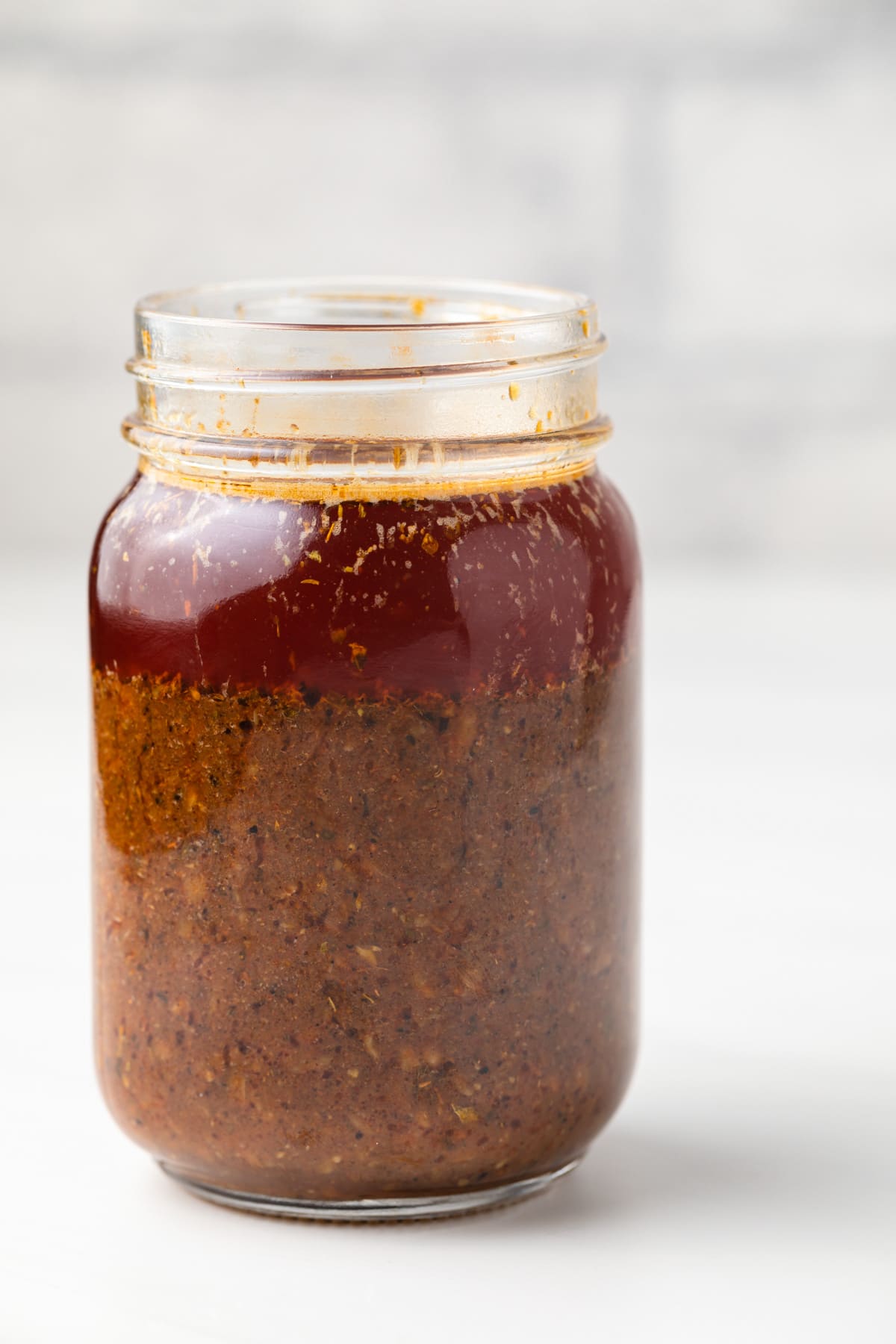 Boiling crab sauce in a glass jar.