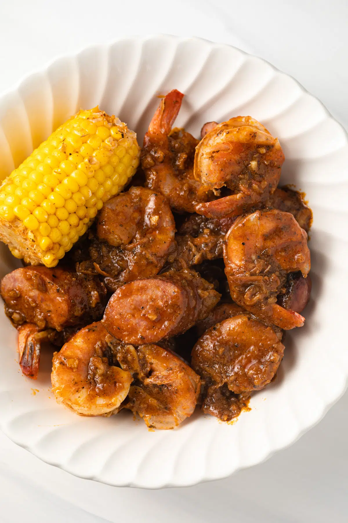 Cooked seafood coated in boiling crab saue.