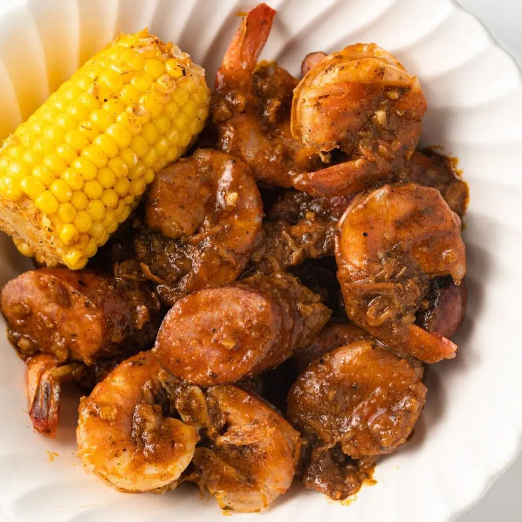 Cooked seafood coated in boiling crab sauce