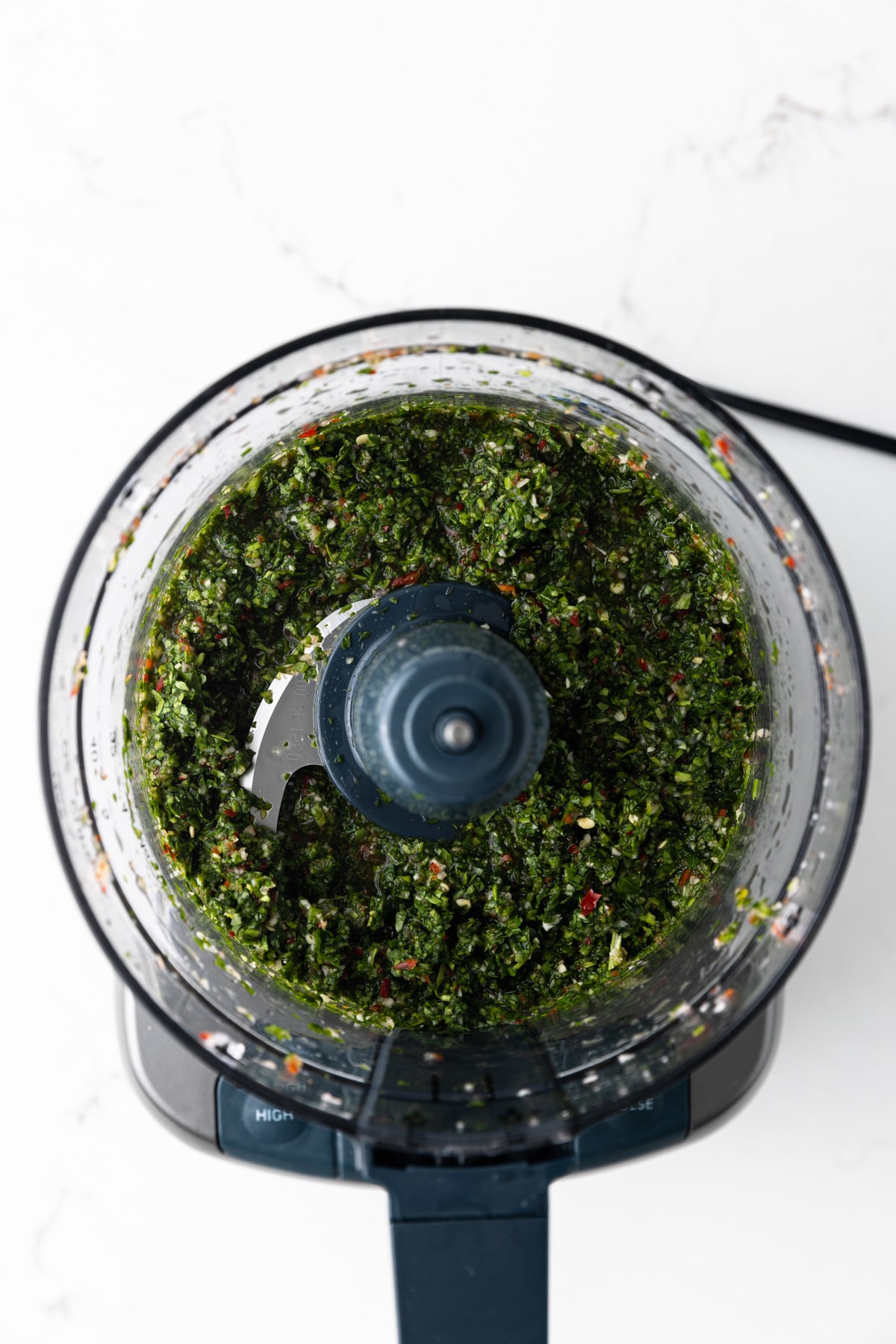 Blended chimichurri in food processor.