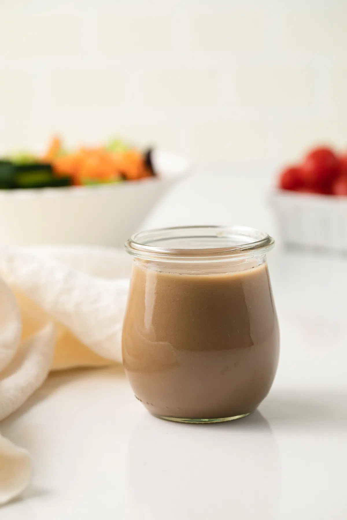 Creamy balsamic dressing in a glass jars.