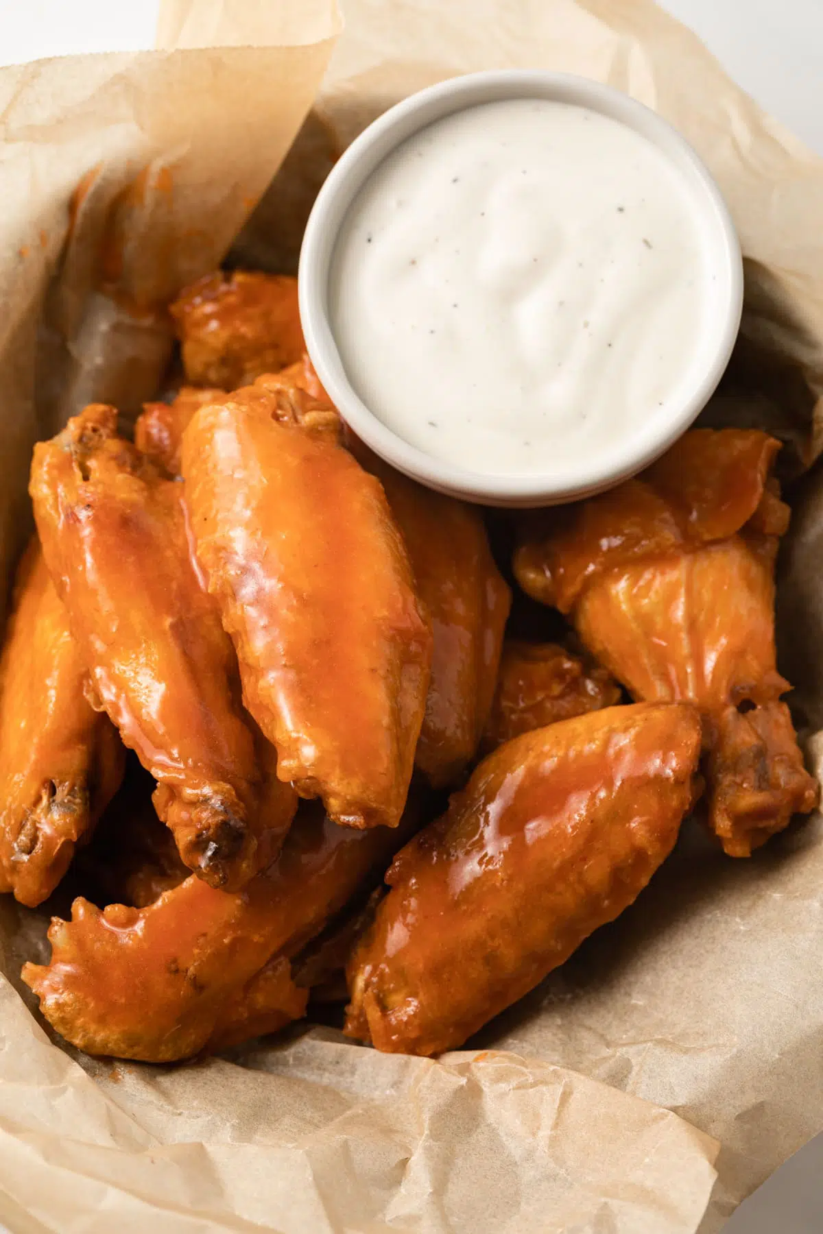 Wings coated in homemade buffalo sauce.