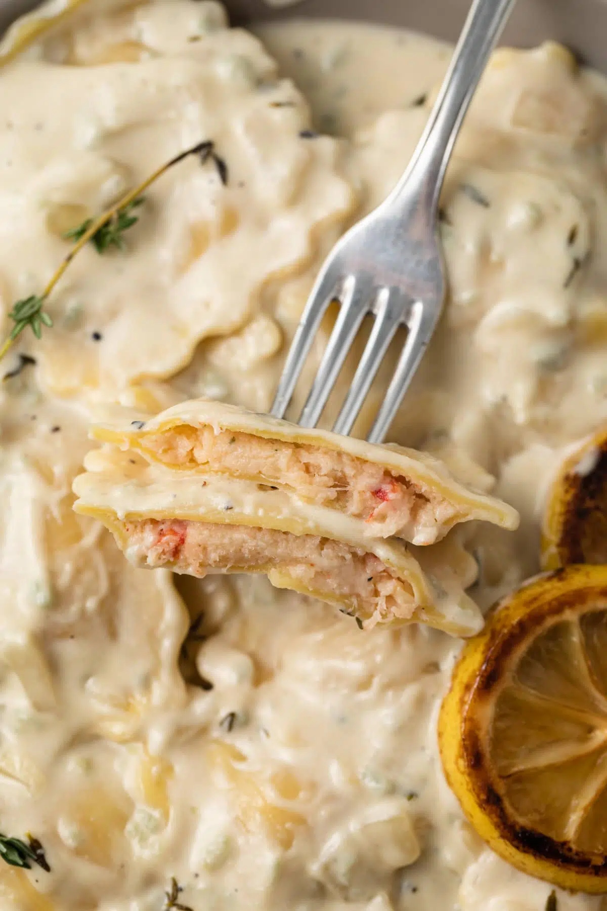 Lobster ravioli on a fork.