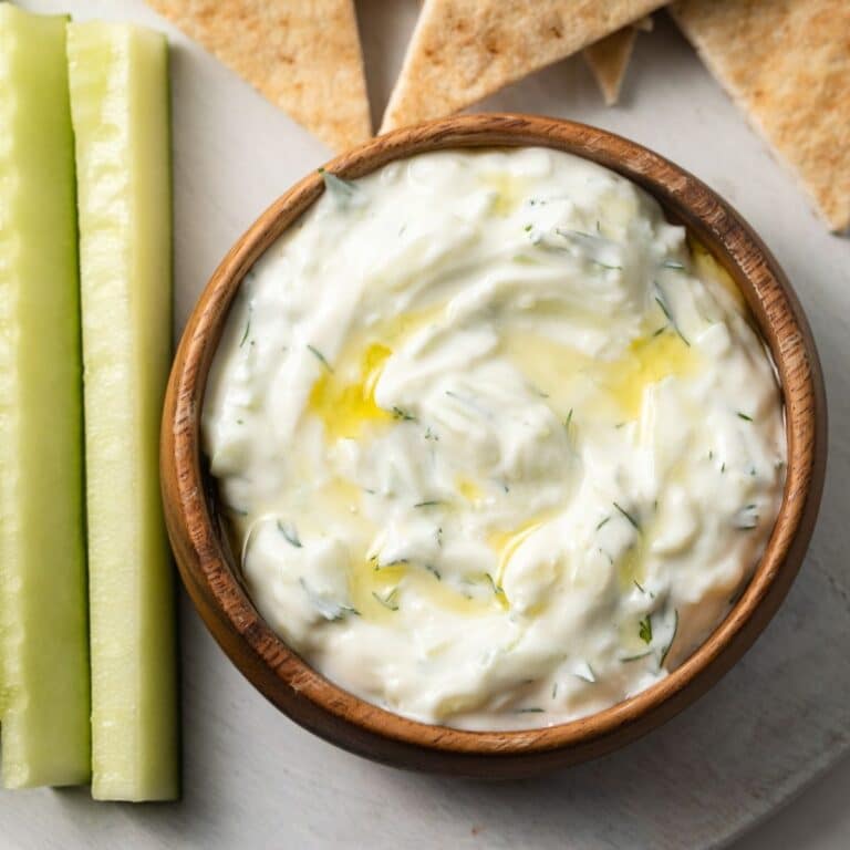 Tzatziki sauce with cucumber spears and pita triangles.