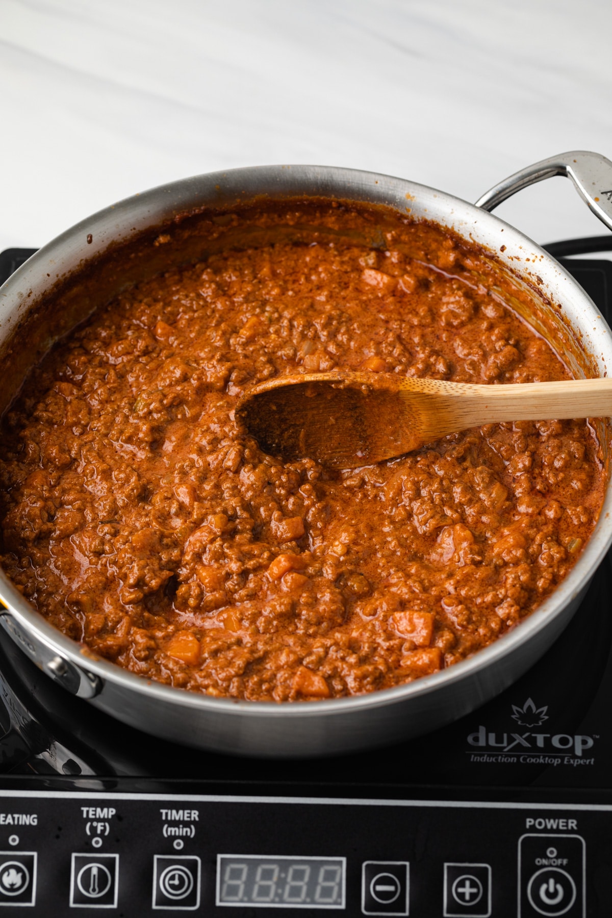 Bolognese sauce in saucepan.