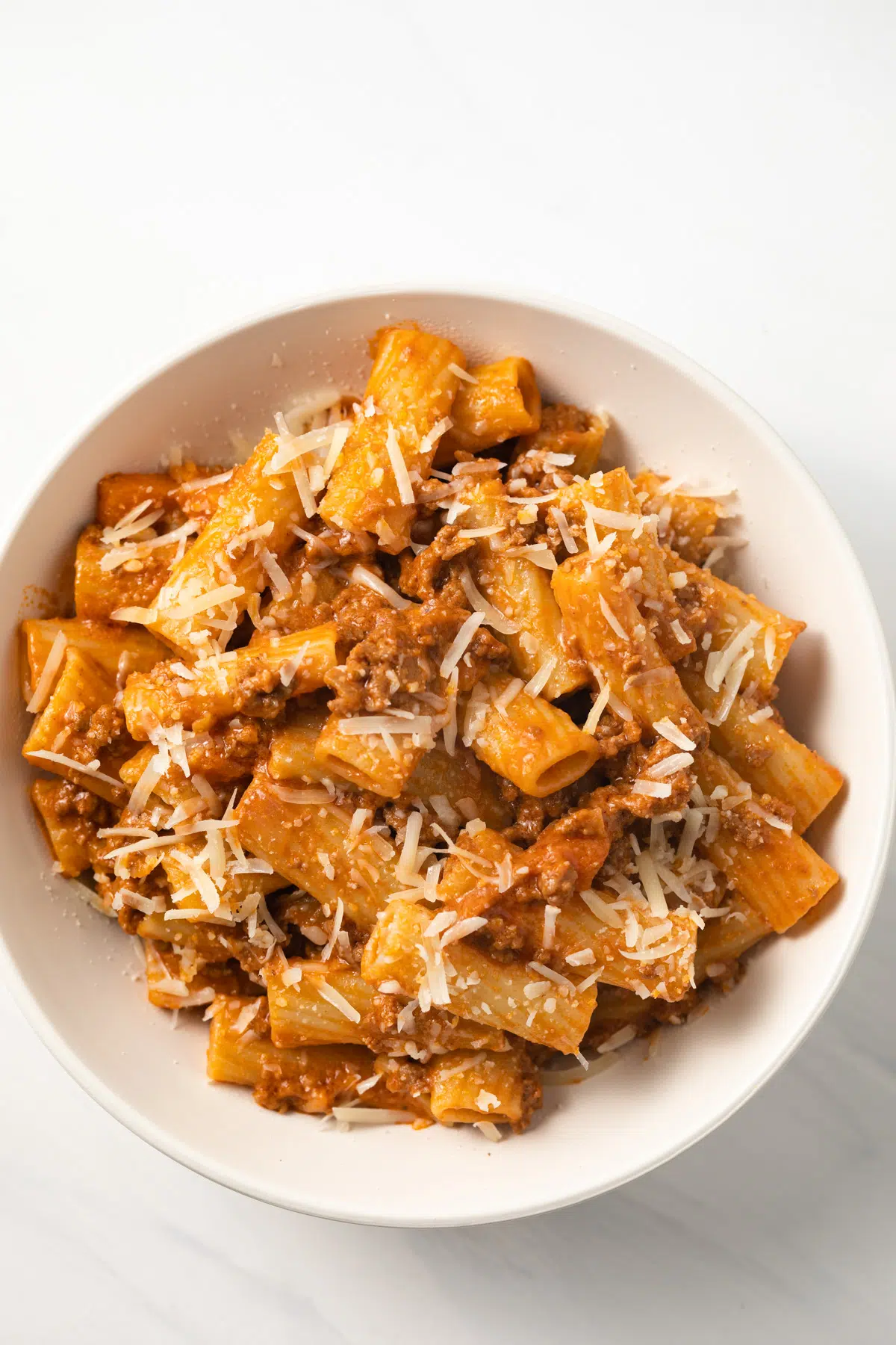 Rigatoni coated in bolognese meat sauce.