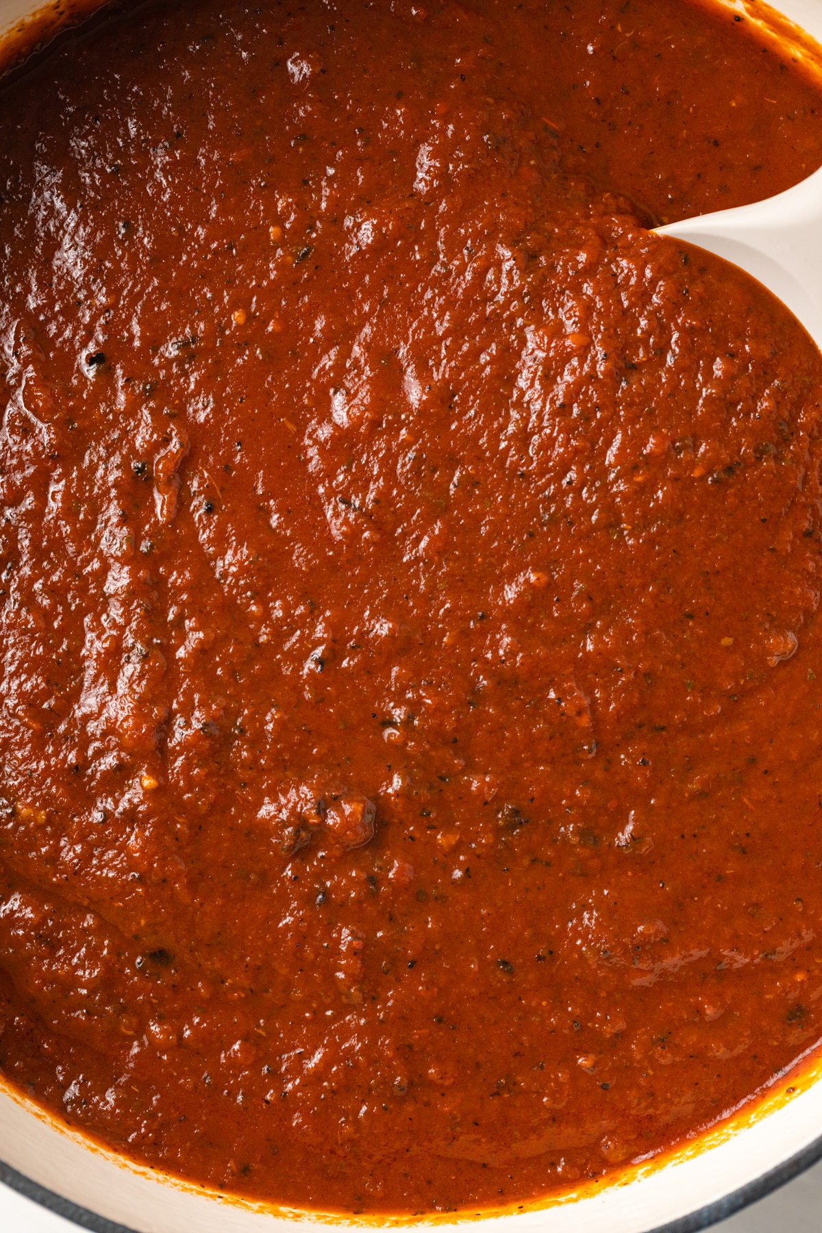 Close up of Italian gravy in pot.