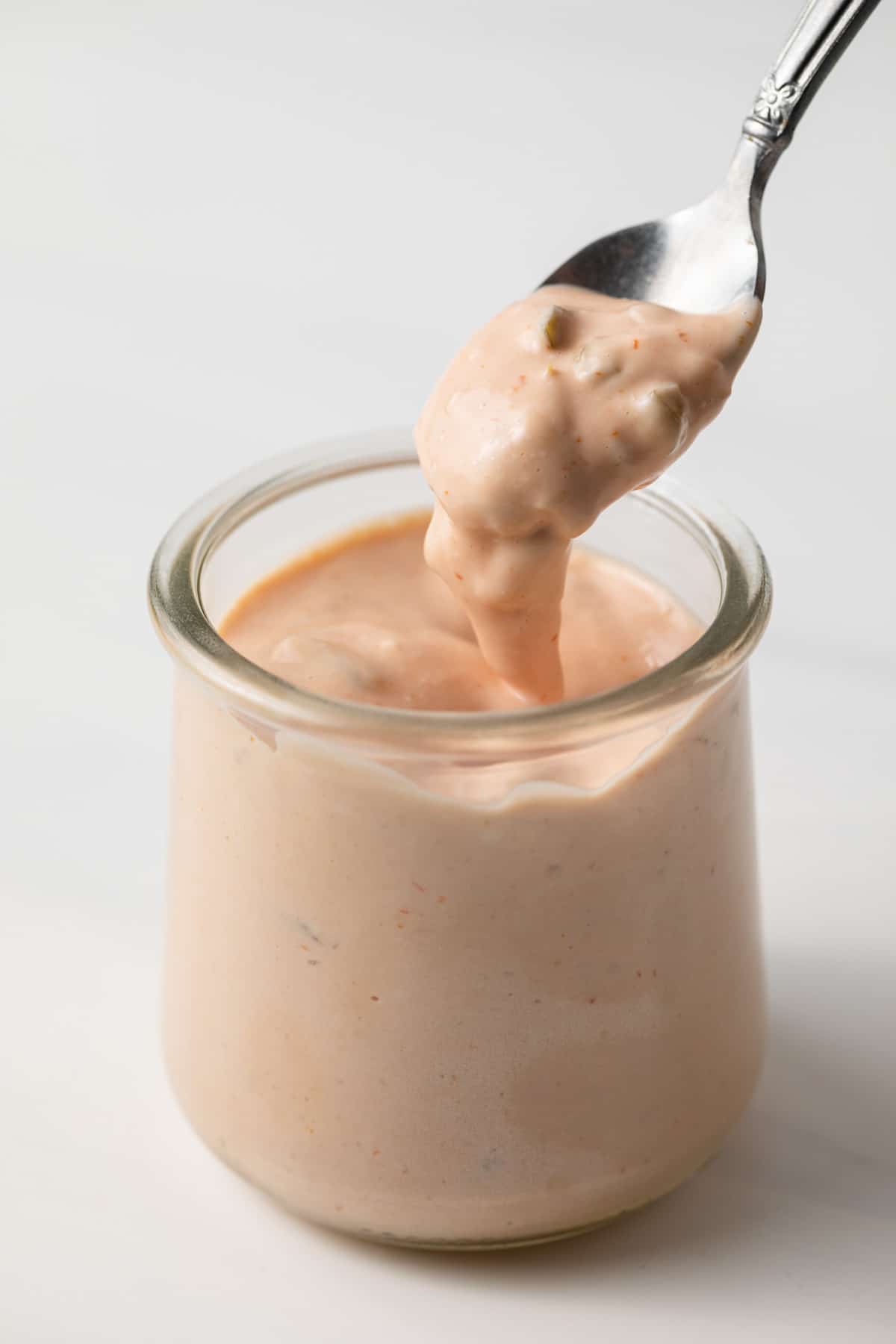 Burger sauce in a jar with spoon.