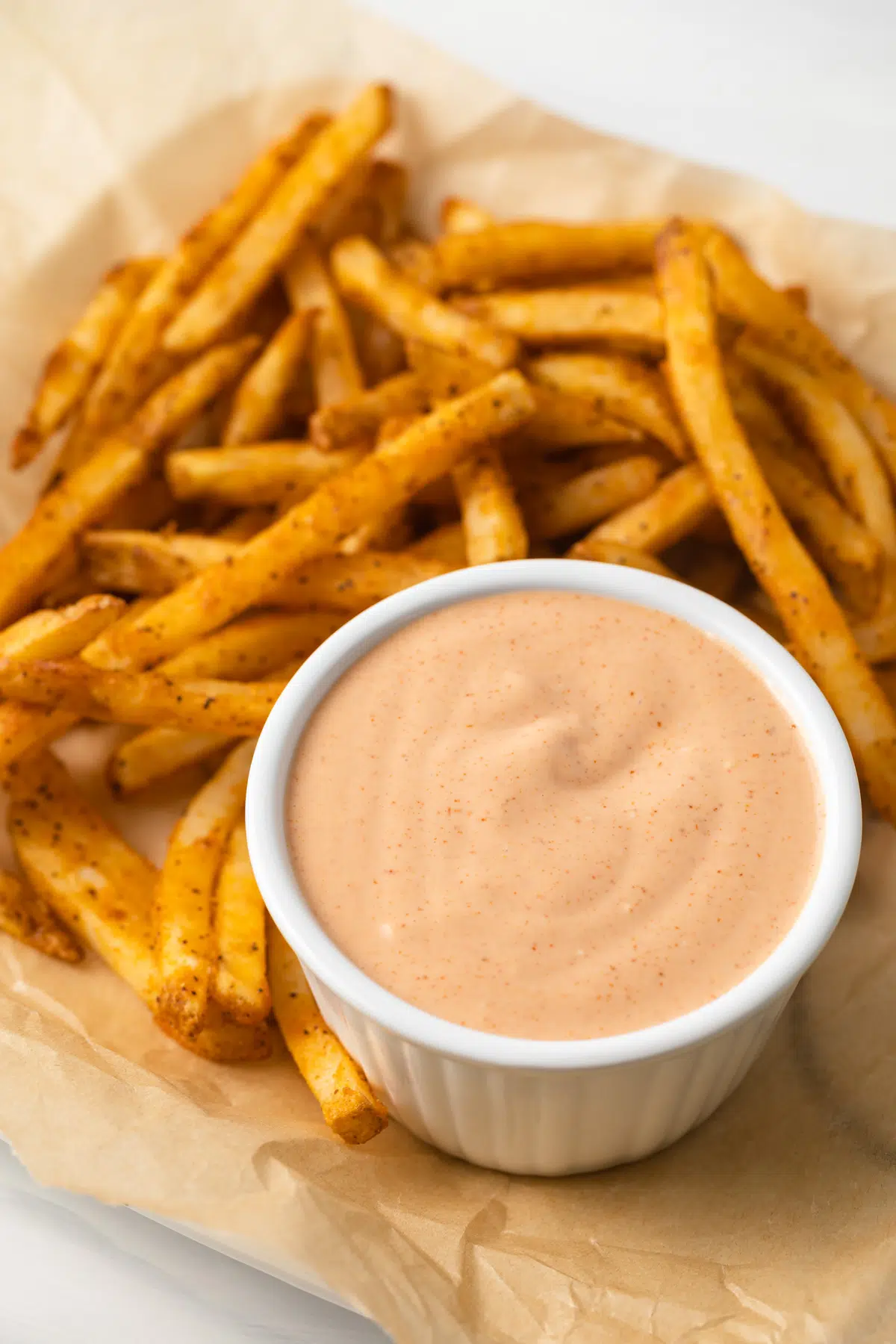 French fry sauce in white ramekin.