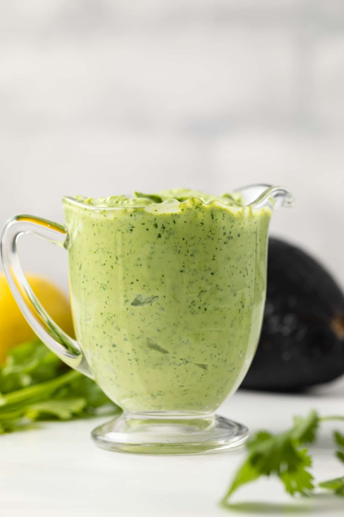 Avocado cilantro dressing in a glass jar.