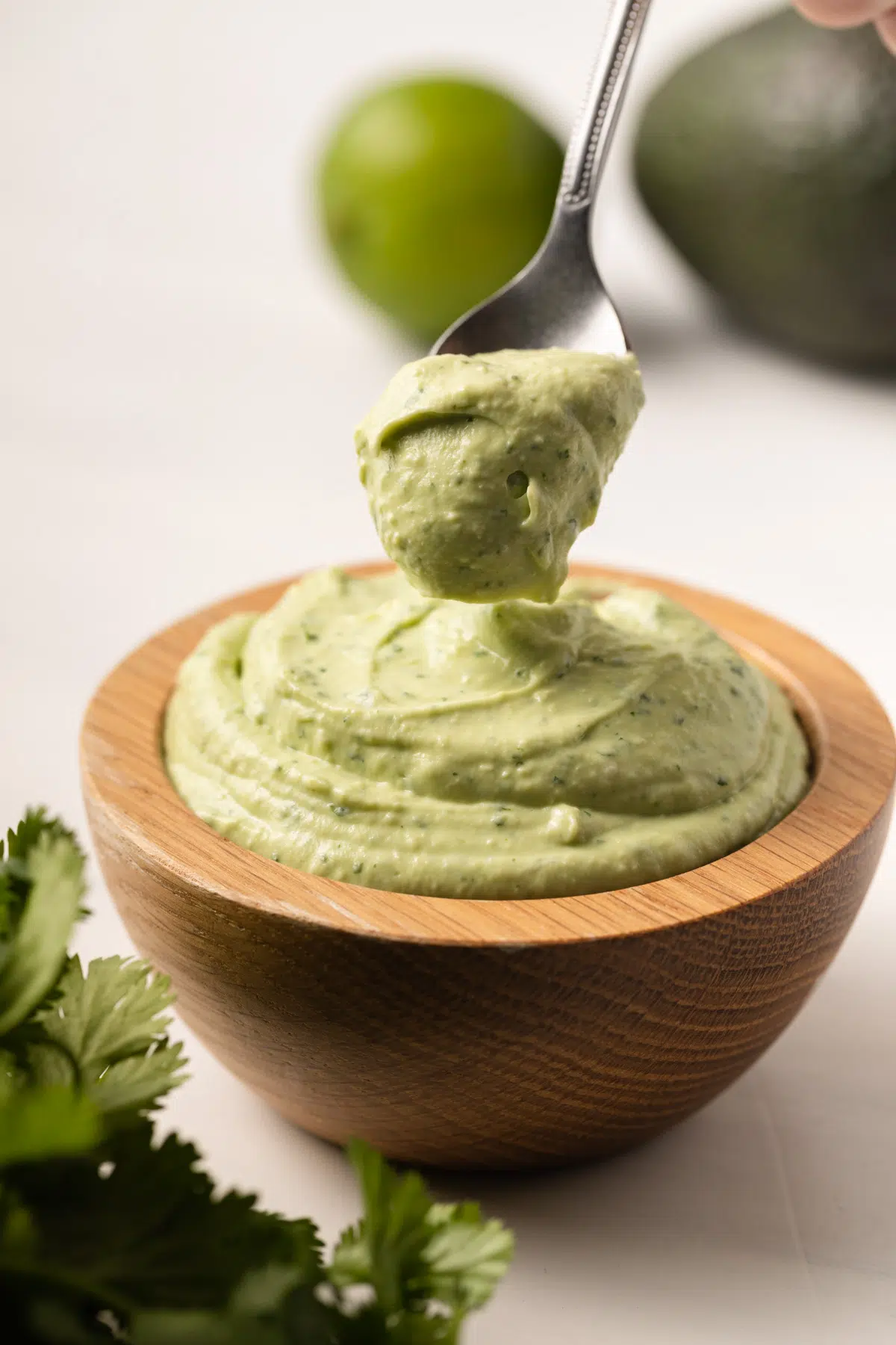 Avocado crema on a spoon.