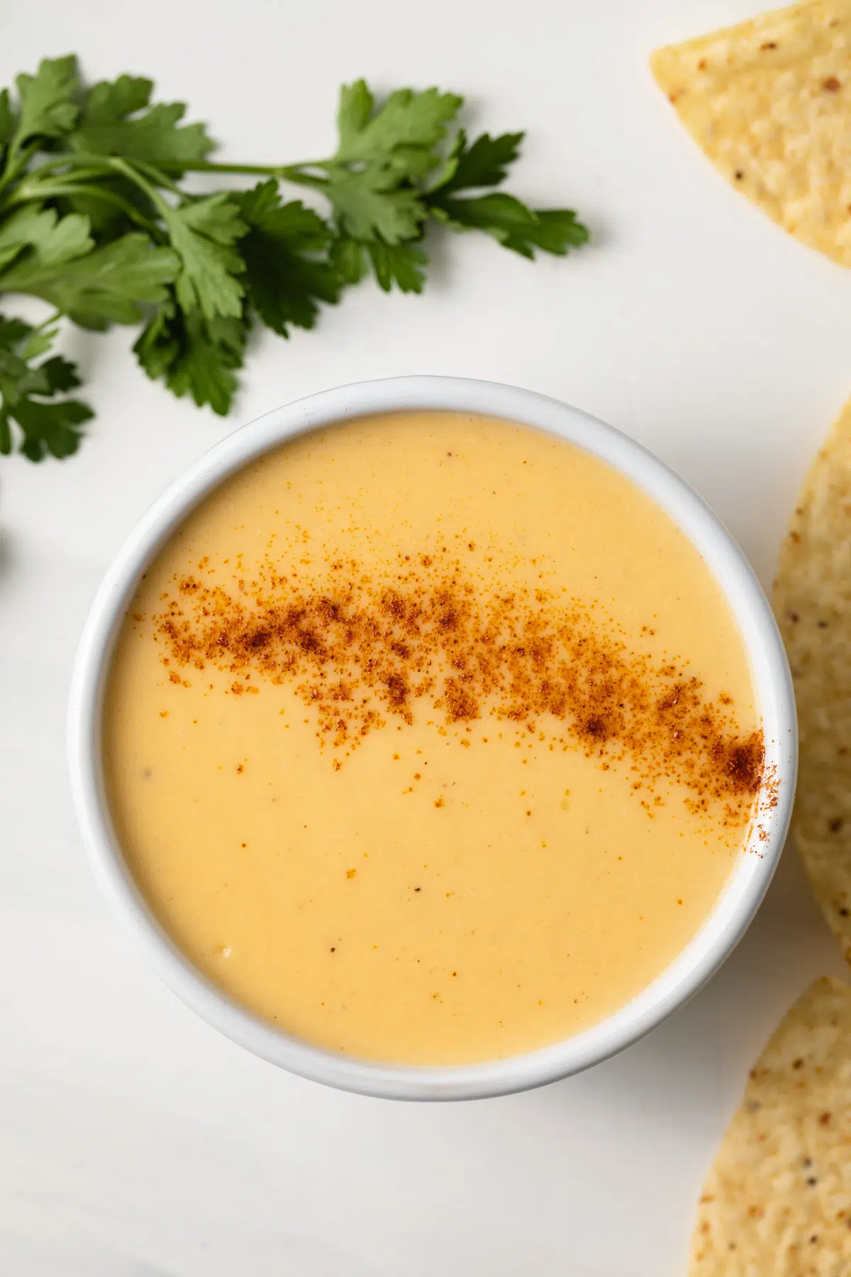 Cheese sauce in a white bowl.