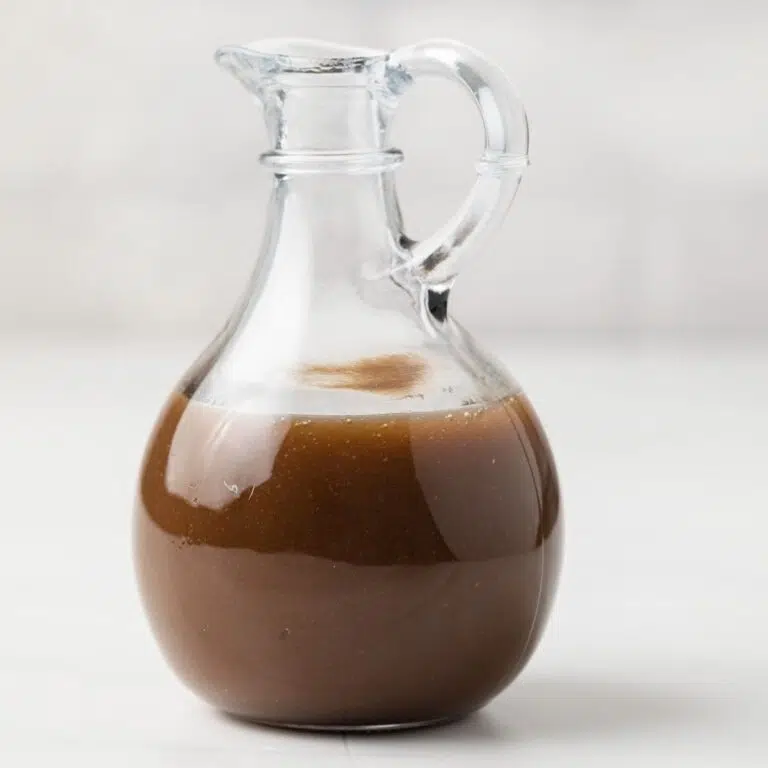 Honey Balsamic Vinaigrette in a small glass jug.