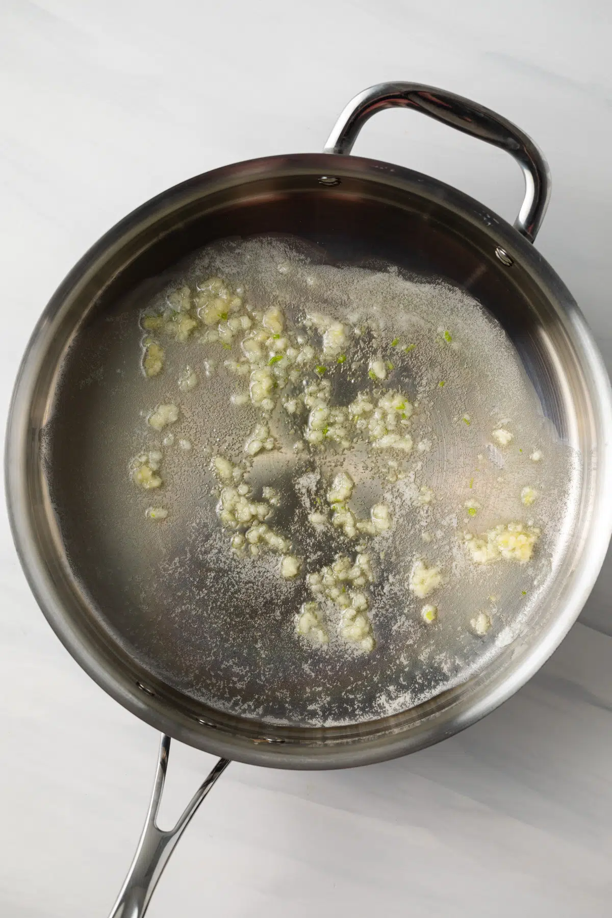 Butter and garlic in skillet.