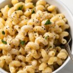 Pasta with lemon pepper garlic cream sauce in a bowl.