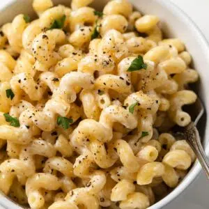 Pasta with lemon pepper garlic cream sauce in a bowl.