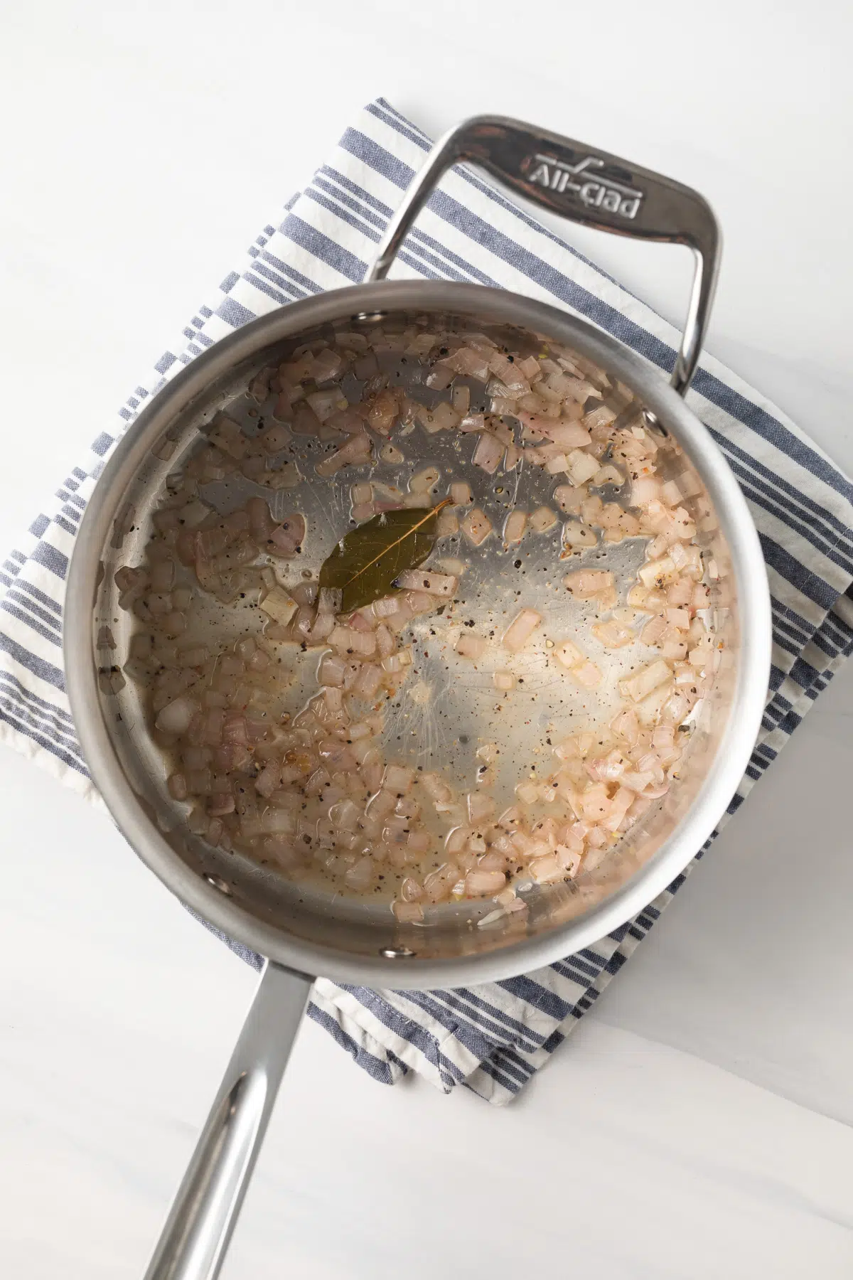 Base of beurre blanc sauce in saucepan.