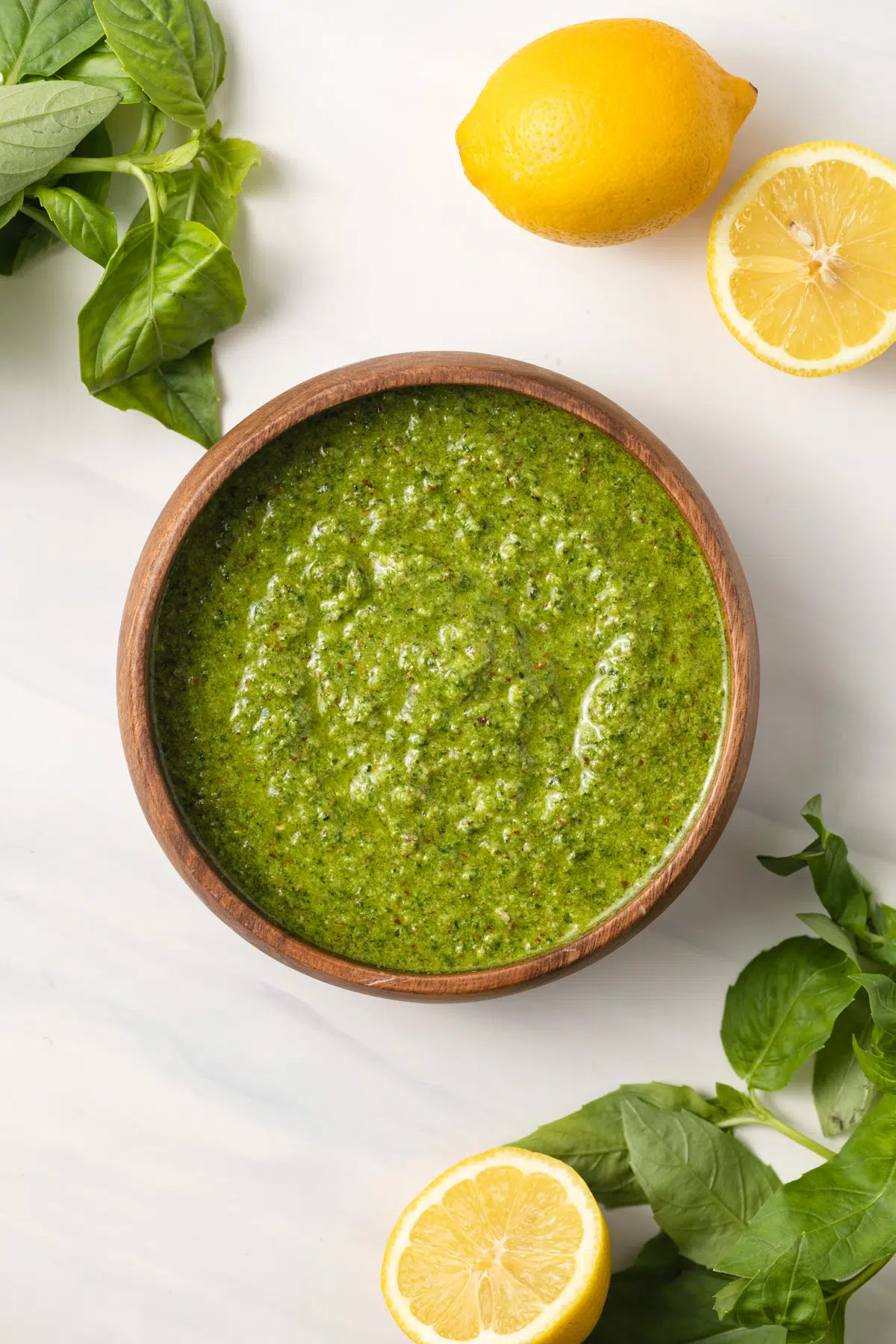 Overhead of lemon pesto in a wooden bowl.