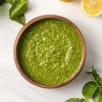 Overhead of lemon pesto in a wooden bowl.