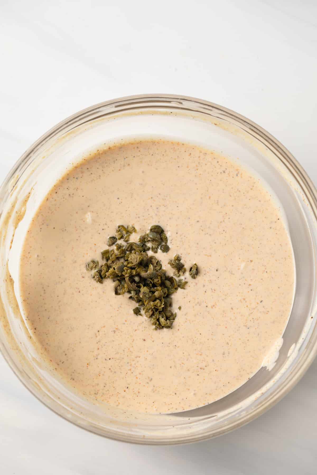 Capers added to remoulade sauce.