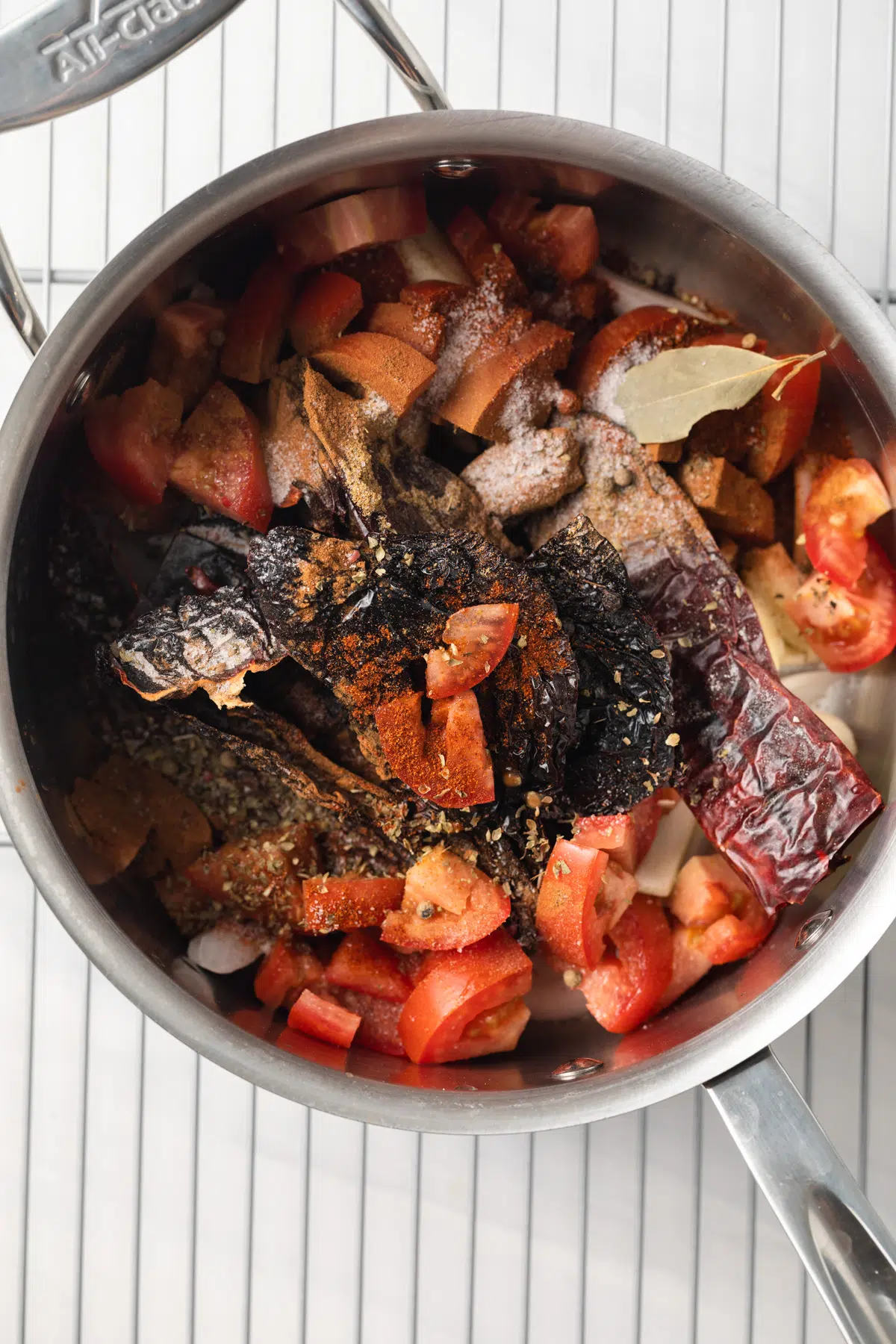 Ingredients for consome sauce in saucepan.