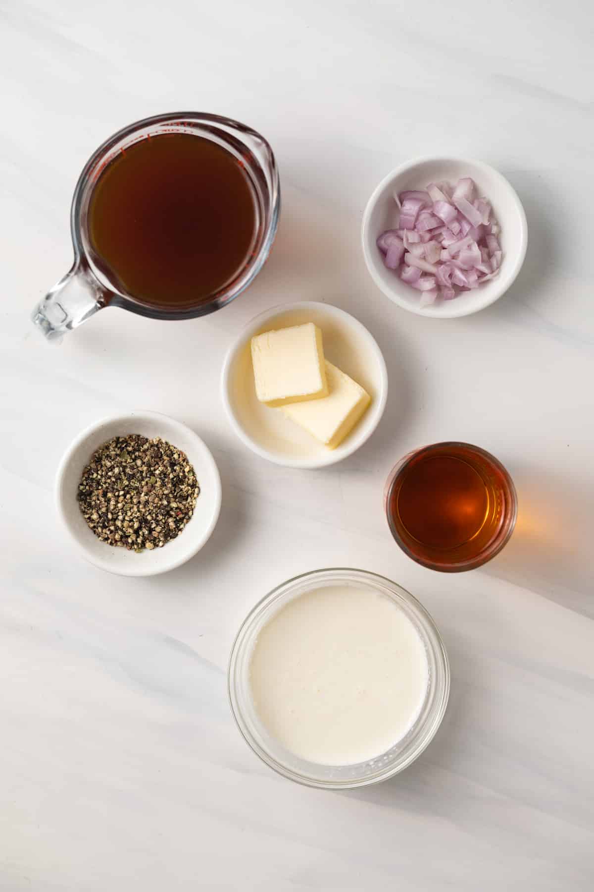 Ingredients for creamy peppercorn sauce.