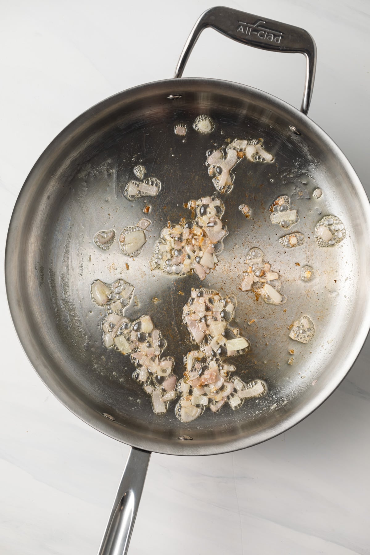 Shallots cooked in a skillet.