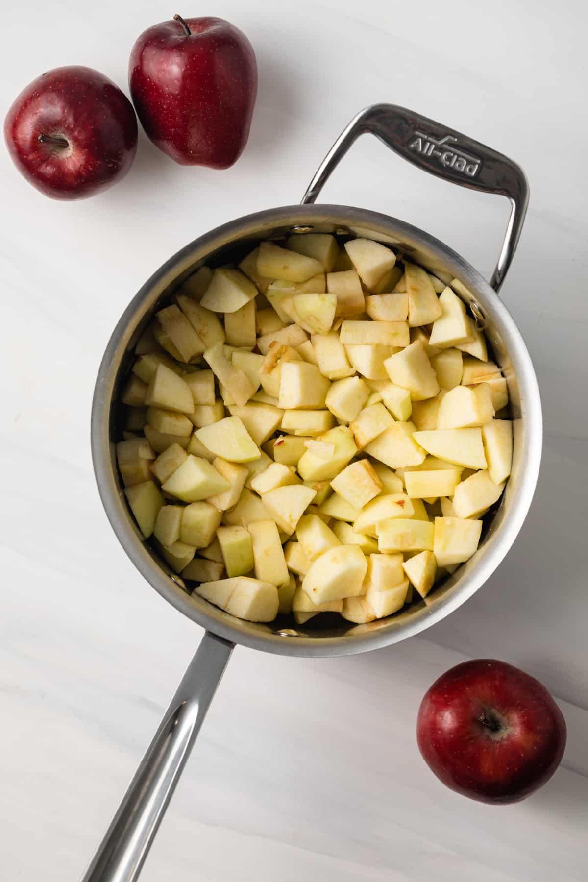 Diced apples in saucepan.