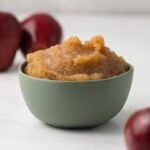 Side view of easy applesauce in green bowl.