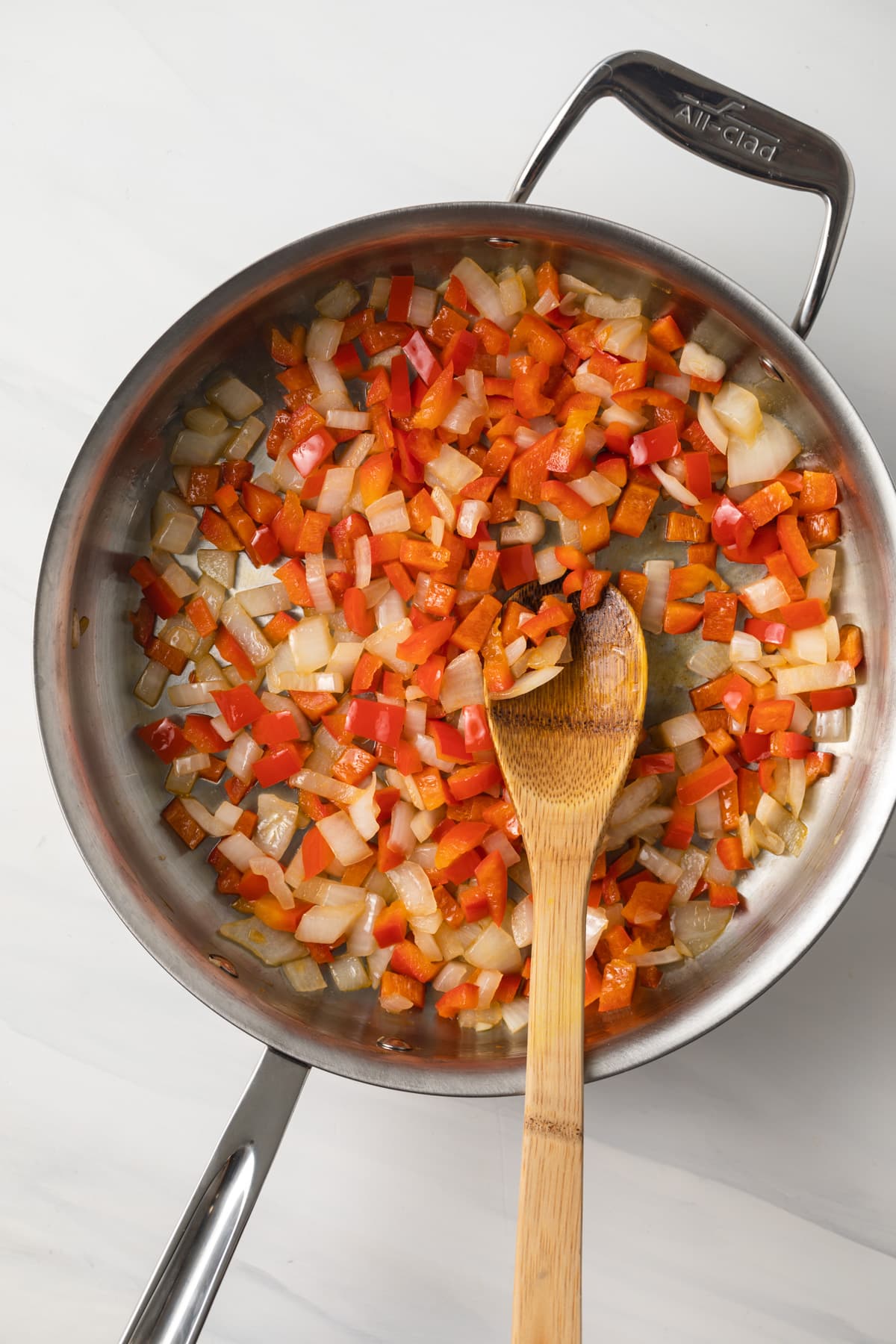 Peppers and onions in large fry pan.