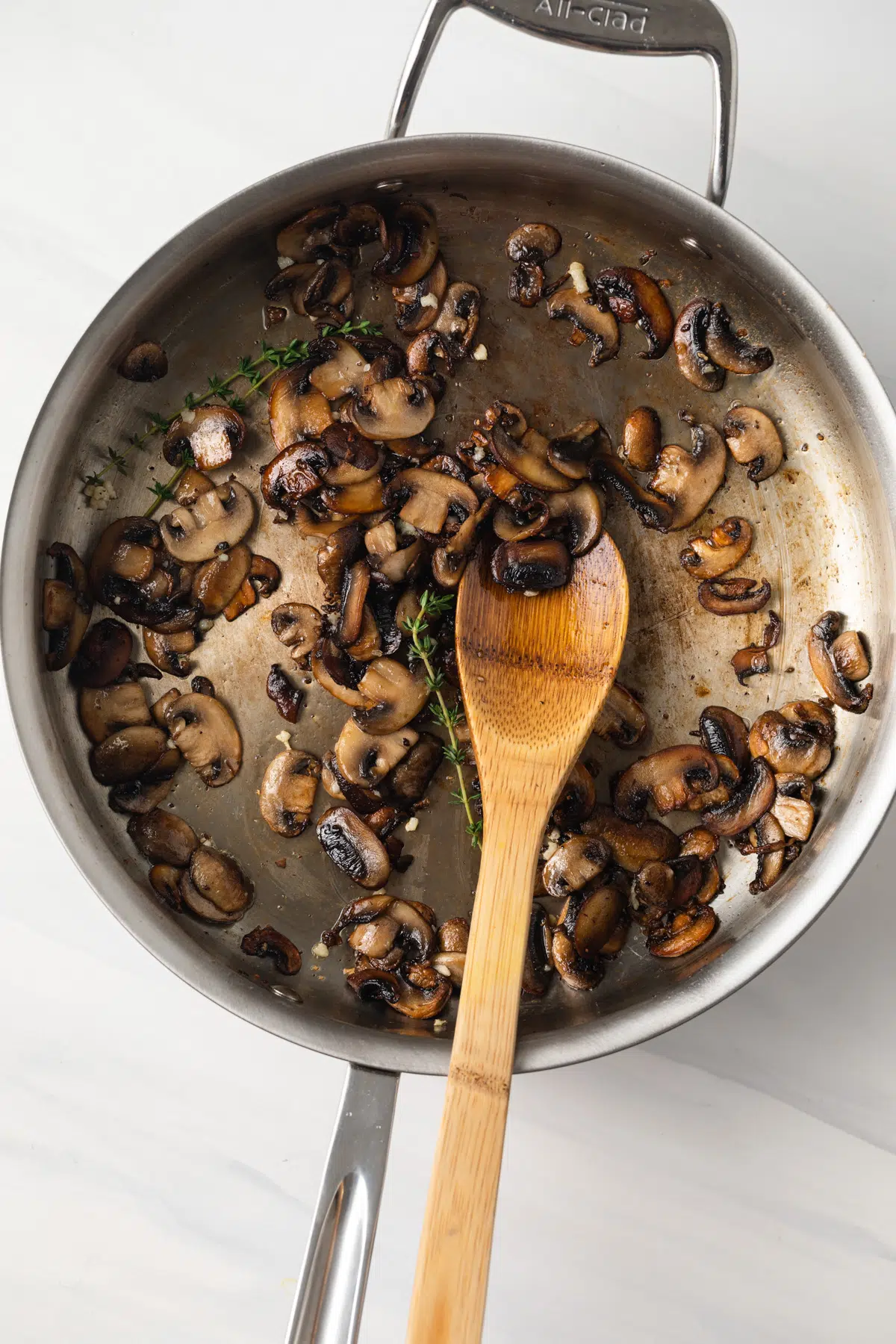 Sauteed mushrooms in a fry pan.