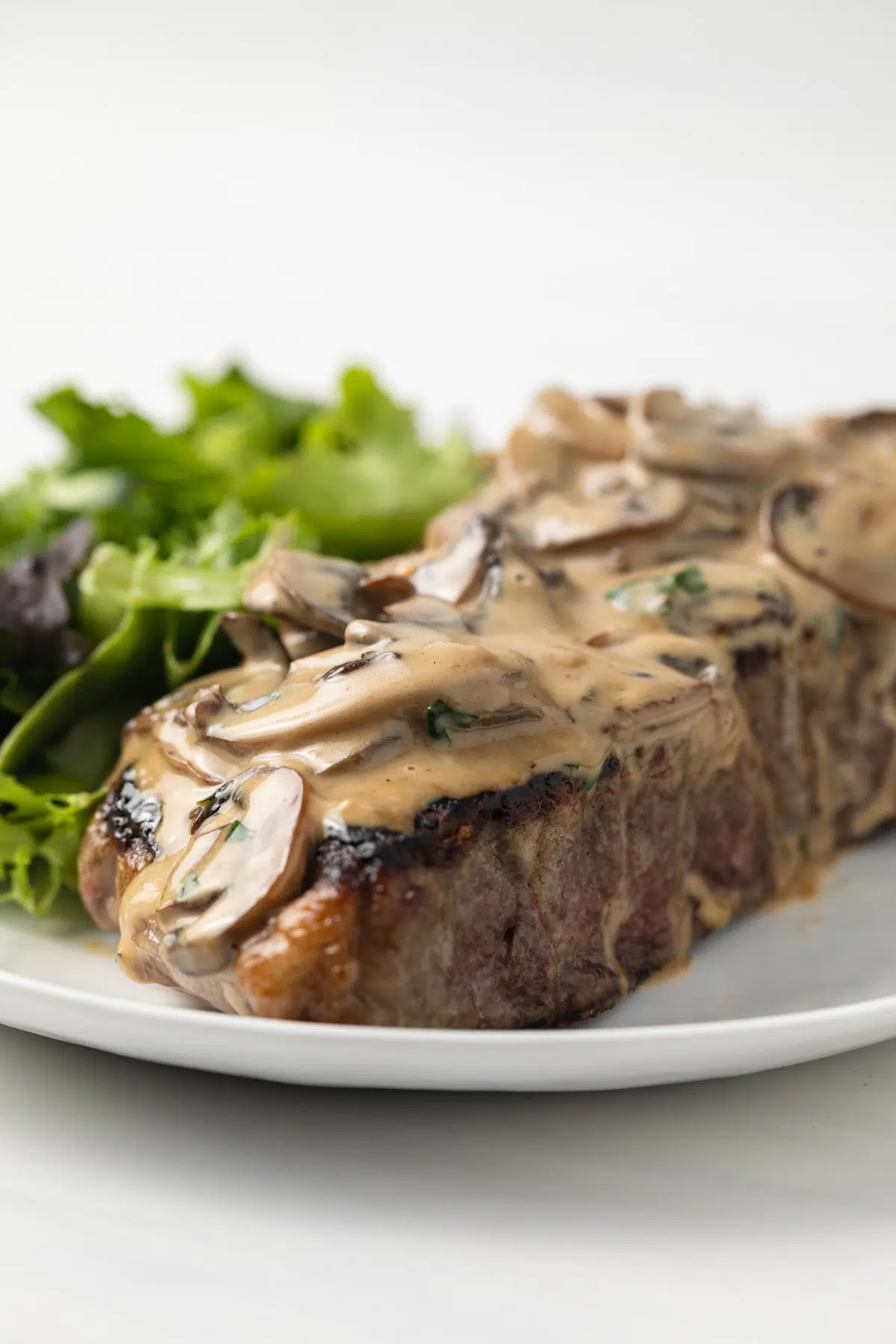 Mushroom sauce over steak.